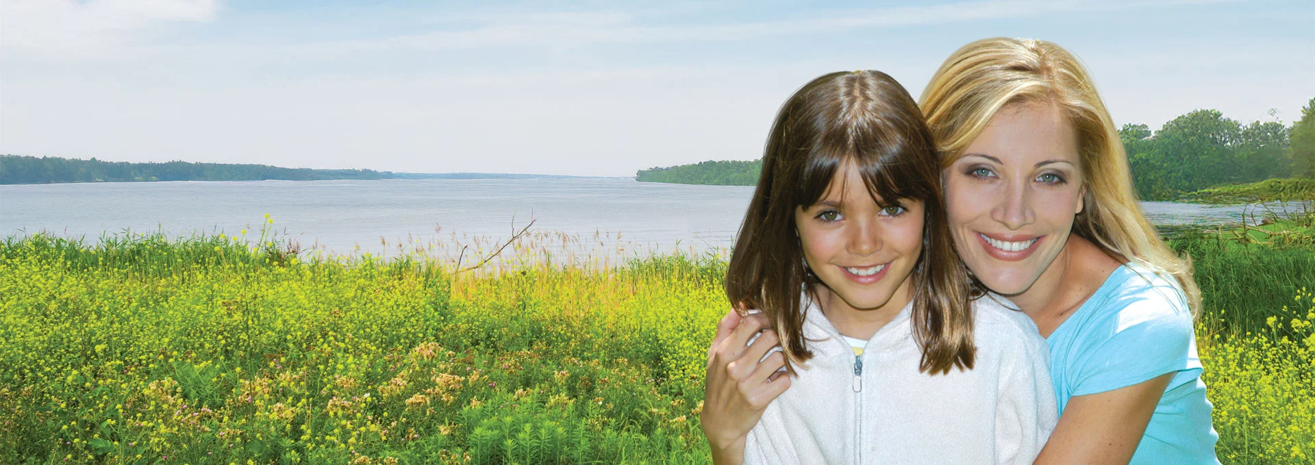 mother and daughter near a lake
